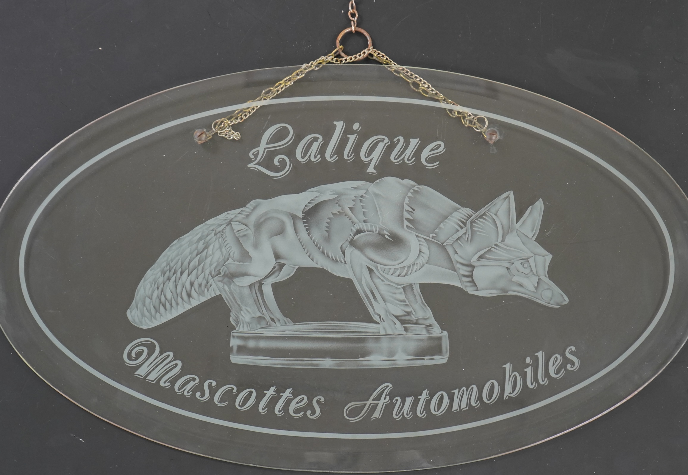 A rare boutique advertising hanging glass sign for Lalique
